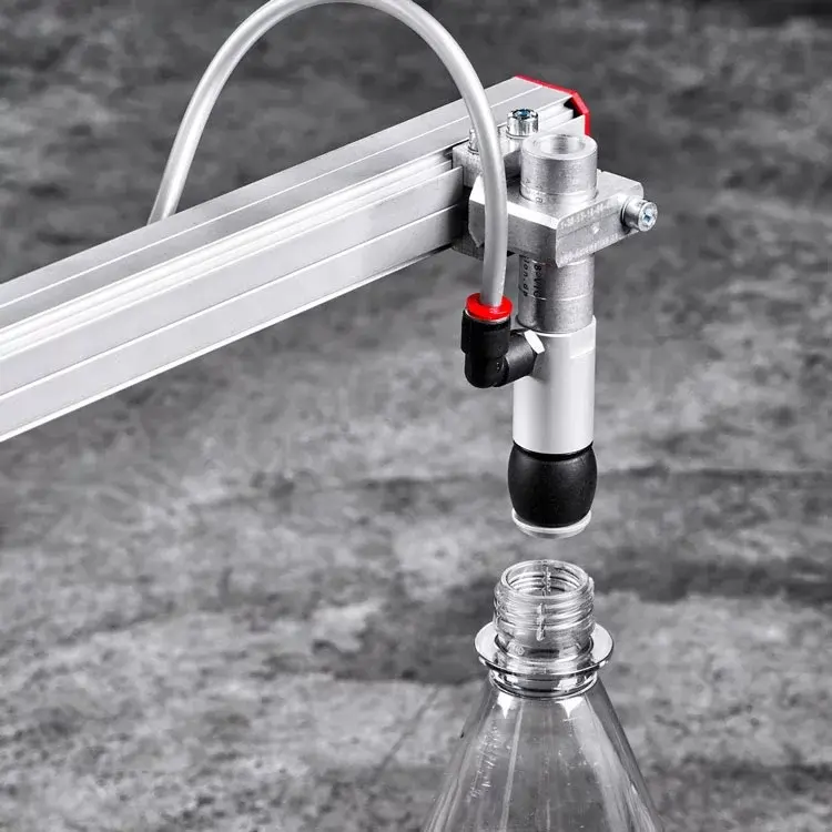 Pneumatic gripper with bellows holding above bottle neck on industrial arm
