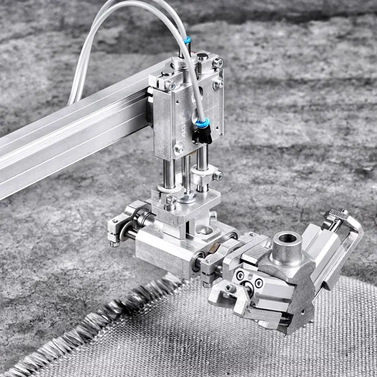 AGS Pneumatic Gripper mounted on rail holding a textured fabric