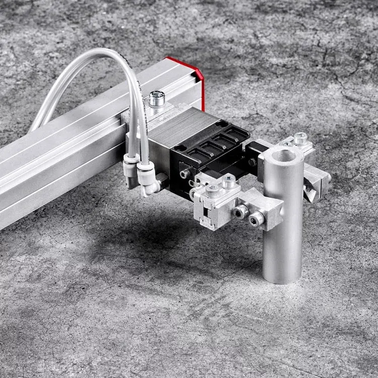 pneumatic parallel gripper holding a cylindrical object on textured surface
