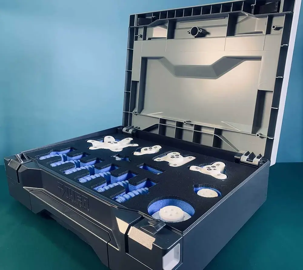 SoftGripping Construction Kit in open case showing organized components including star-shaped parts and soft fingers