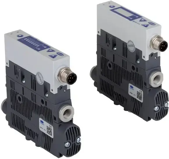 two views of a compact ejector with black body and grey top panel with digital display and connector