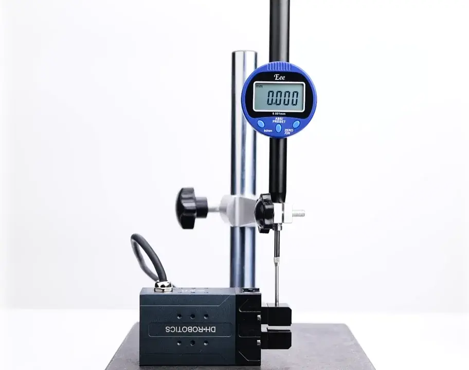 electric parallel gripper mounted for measurement with digital gauge