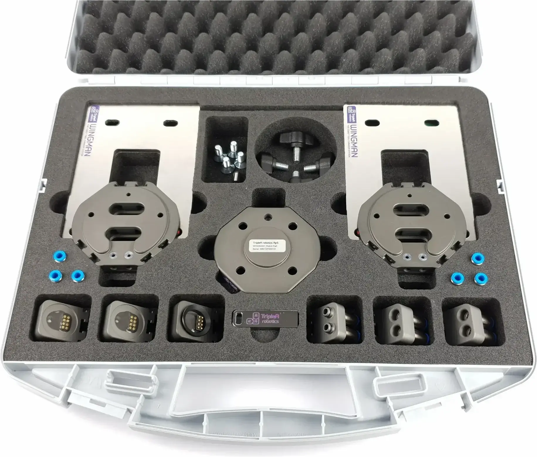 top view of WINGMAN Automatic Tool Changer kit with two main units, connectors, and parts in case