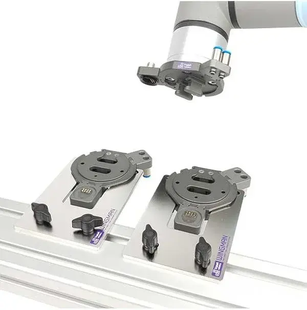 Two WINGMAN tool changer units in side view with robotic arm nearby