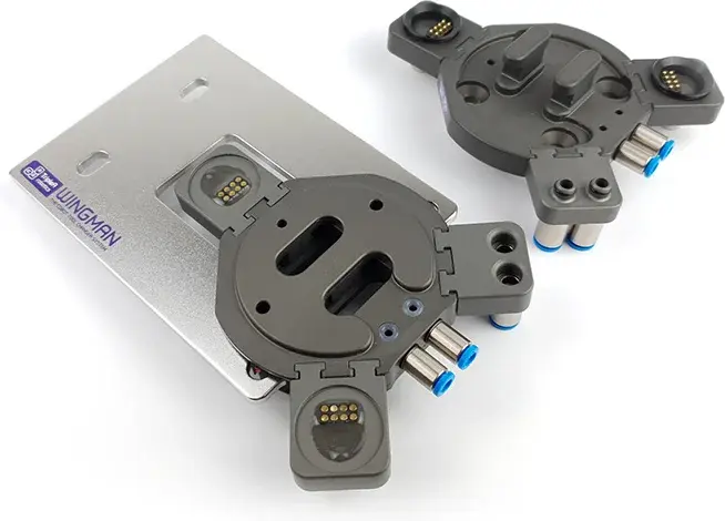 Close-up top view of two WINGMAN automatic tool changer units on a white background