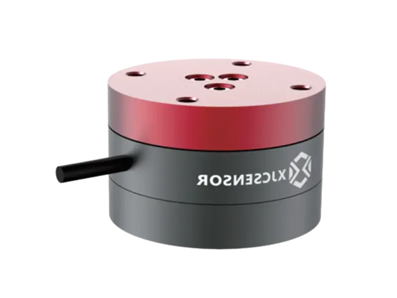 side view of red and gray cylindrical force/torque sensor with cable