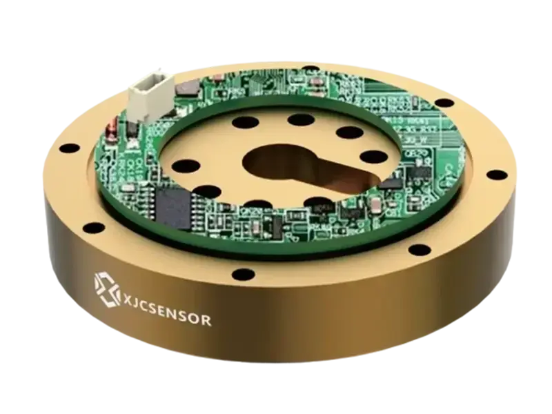 top view of a six-axis force/torque sensor showing internal circuit board and mounting holes