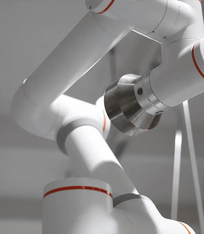 Close-up view of white robotic arm joints with orange rings and metal attachment