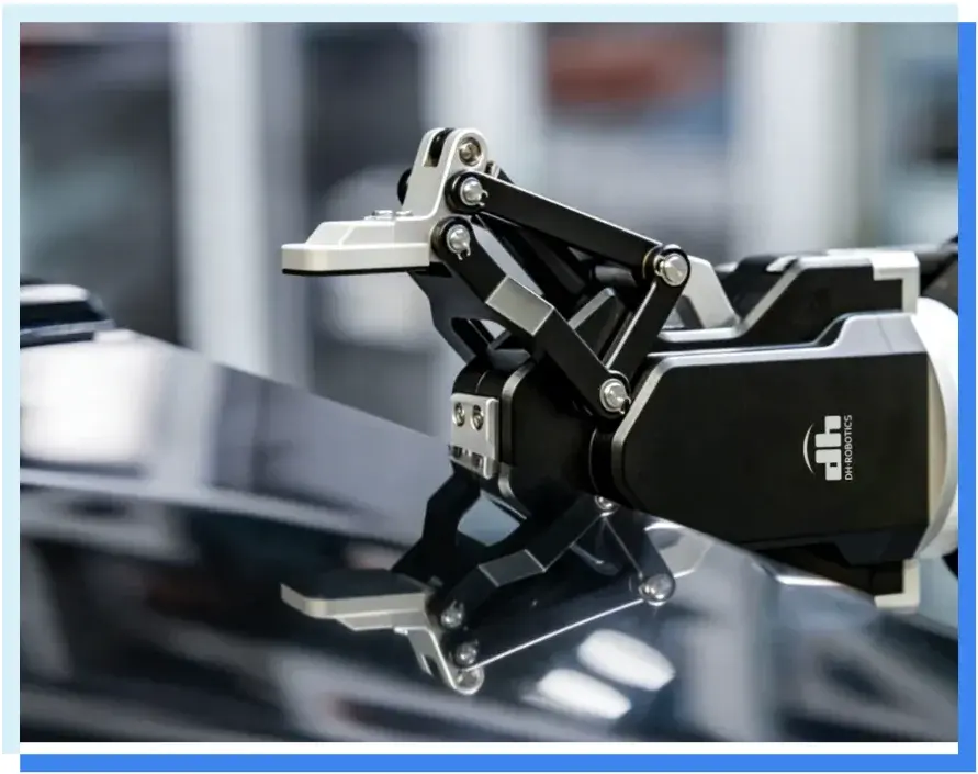 close-up side view of a 3-finger DH Robotics AG3 gripper mounted on a shiny surface