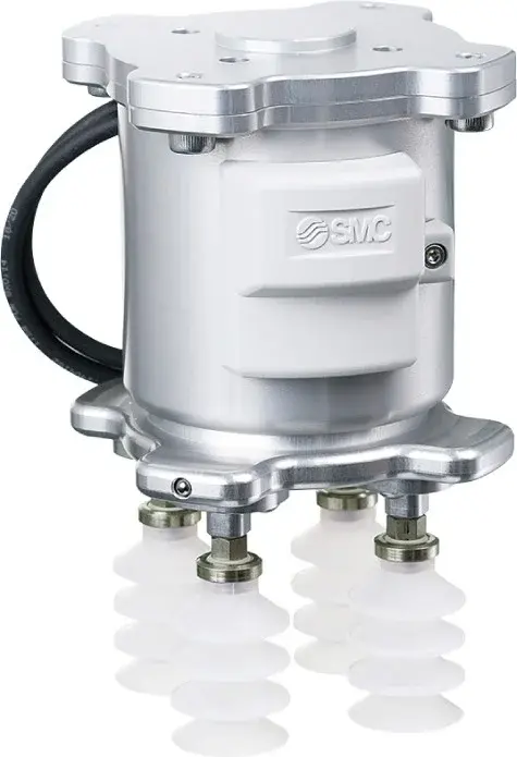 close-up side view of SMC vacuum gripper showing the housing and four white suction cups
